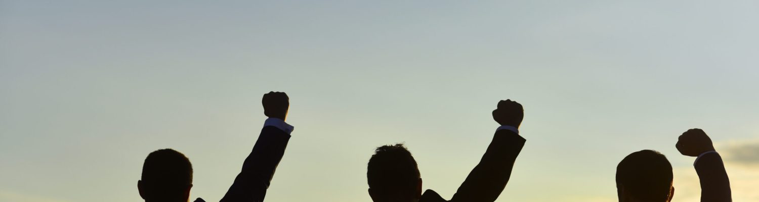 Leaders discuss, project hold hands up. Silhouettes of men standing against evening sky. Managers wearing smart suits admire view. Business and success concept.